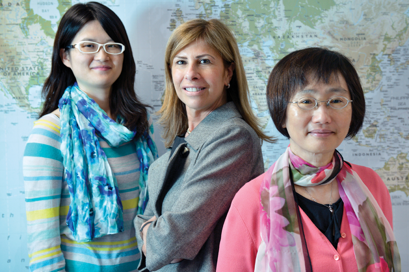 Yuyuan Liu, Mary Mazzola, & Irene Wong in front of a map