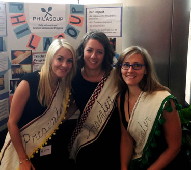 Three women pose in PhilaSoup sashes