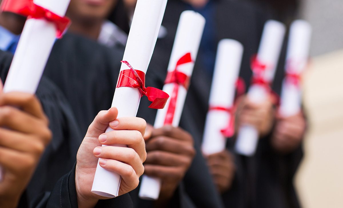 Graduates with diplomas