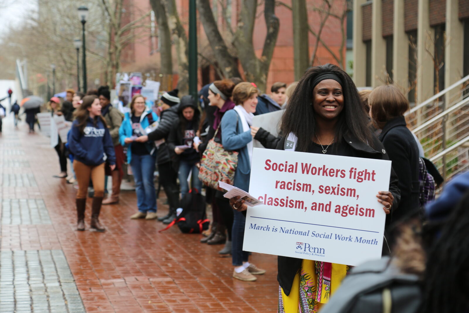 Students hold up signs during the 2018 Social Work Shout Out Rally