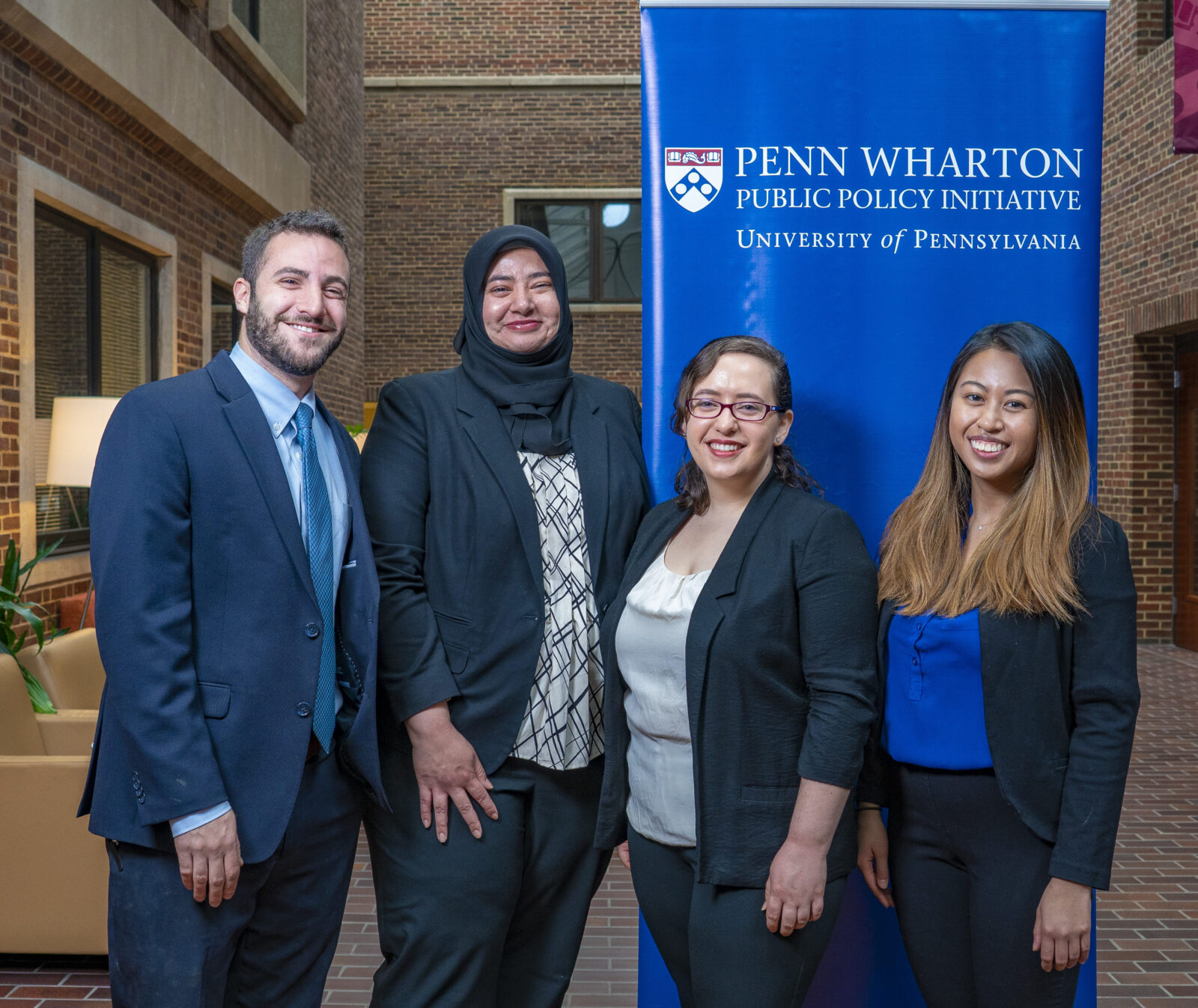 Pictured at the competition from left to right: Sam Margolius, Nadia Malik, Jenessa Irvine, and Blanca Castro