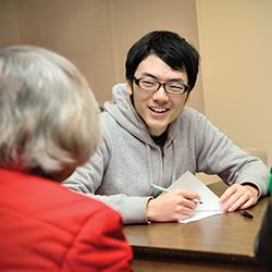 Student speaks with a client