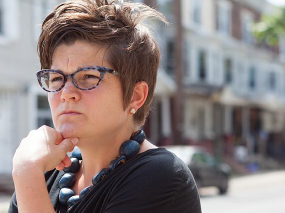 Amy Castro Baker looks pensively down street