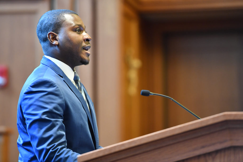 Walter Jean-Jacques speaks at podium