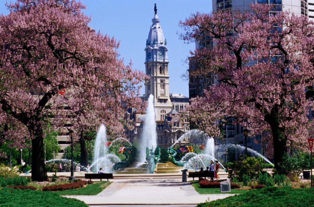 Building with fountain and park