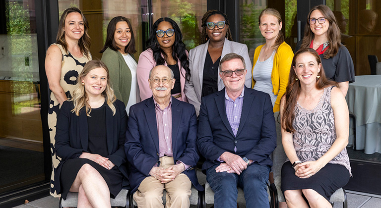 Ten members of the AISP team pose as a group