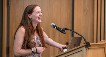 Amy Hawn Nelson speaks at a podium