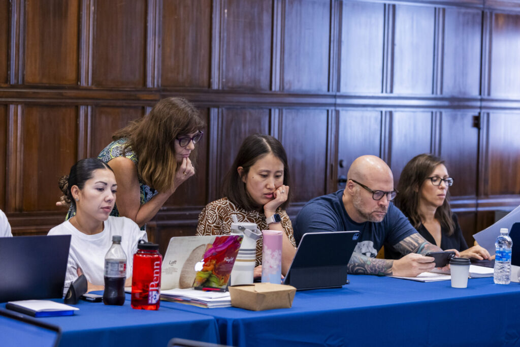 Program director Jacqui Corcoran works with doctoral students in the DSW program.