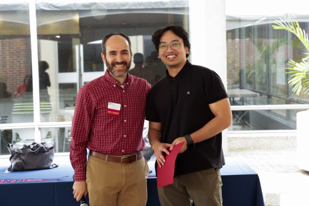 Two people take a picture together at SP2's Celebrating Partnerships and Student Impact event