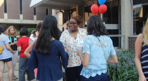 a group of adult students in the midst of a conversation