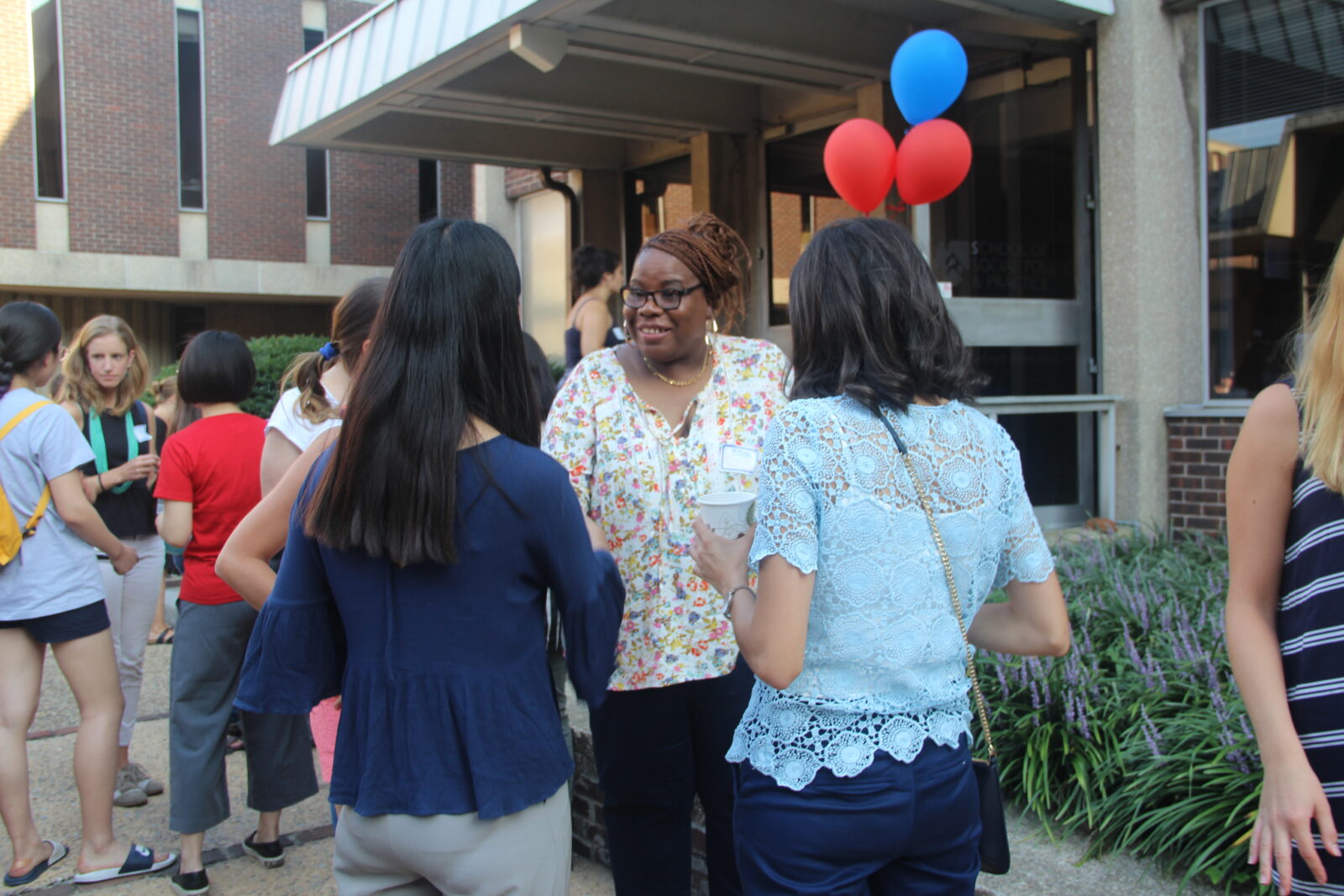 a group of adult students in the midst of a conversation