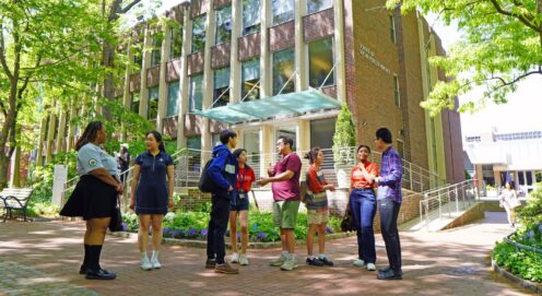 SP2 students standing outside the Caster building on Locust Walk