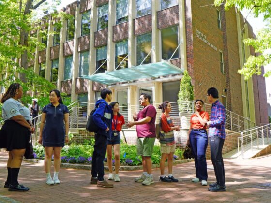 SP2 students standing outside the Caster building on Locust Walk