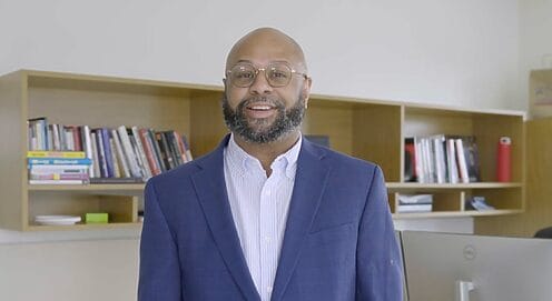 Desmond Patton in his office, discussing AI interventions to combat youth violence