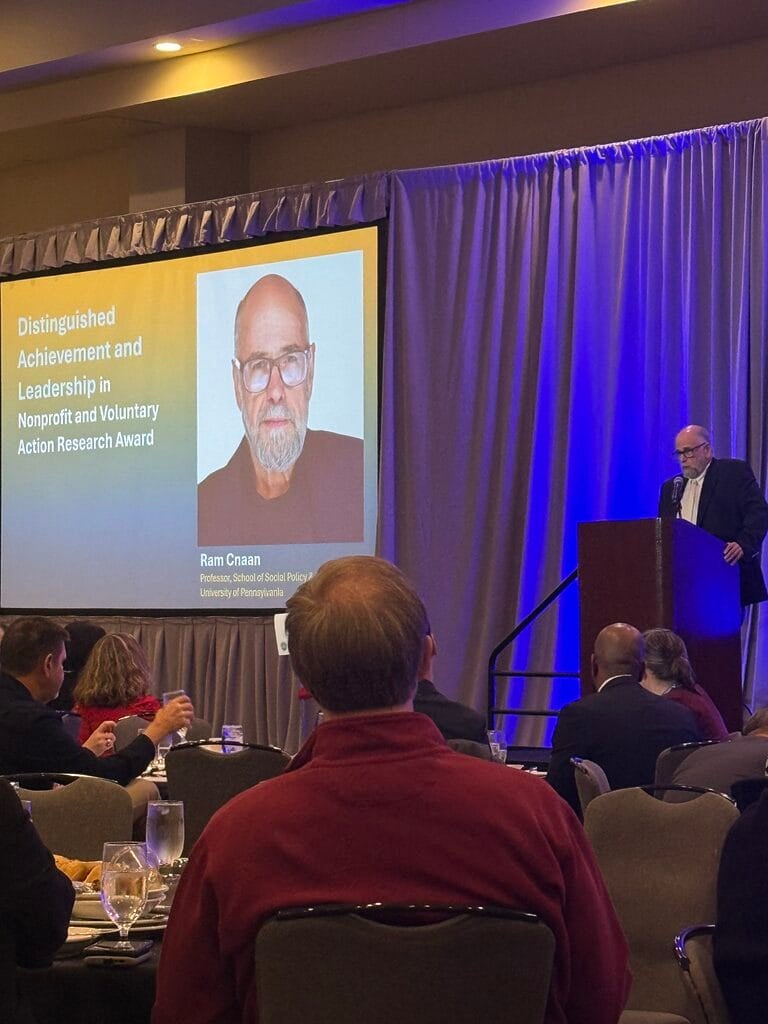 Dr. Ram Cnaan accepting the ARNOVA Distinguished Achievement and Leadership in Nonprofit and Voluntary Action Research Award